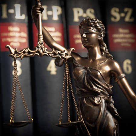This bronze Lady Justice statue, often called Themis, is depicted blindfolded and holding the balancing scales.